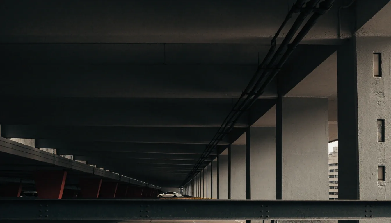 Painted concrete column meeting the ceiling inside an undercover airport car park